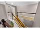 Bright stairway with hardwood stairs and decorative wood railing at 346 Willet Ave, Apopka, FL 32703