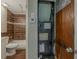 Bathroom includes a tiled shower over tub, a toilet, and an adjacent utility closet at 3718 Mitchell Rd, Orlando, FL 32808