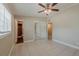 Spacious bedroom includes tile floors, ceiling fan, closet and bathroom access at 3718 Mitchell Rd, Orlando, FL 32808