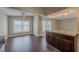 Bright dining area featuring wood-look tile floors, ceiling fans, and natural light from multiple windows at 3718 Mitchell Rd, Orlando, FL 32808