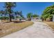 Charming single-story home featuring a spacious yard and a long, curved driveway at 3718 Mitchell Rd, Orlando, FL 32808