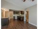 Open kitchen with stainless steel appliances and granite countertops at 3718 Mitchell Rd, Orlando, FL 32808