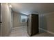 Practical kitchen space with tile flooring, a window, and a stainless steel refrigerator at 3718 Mitchell Rd, Orlando, FL 32808
