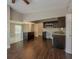 Modern kitchen with dark cabinets, wood flooring, and a center island at 3718 Mitchell Rd, Orlando, FL 32808