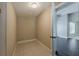 Small laundry room featuring tile floors, neutral walls, and washer/dryer hookups at 3718 Mitchell Rd, Orlando, FL 32808