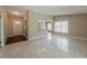 Open-concept floor plan combining the living area and entryway at 3718 Mitchell Rd, Orlando, FL 32808