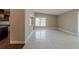 Spacious living room with tile floors and lots of natural light at 3718 Mitchell Rd, Orlando, FL 32808