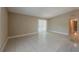 Bright and airy living room with access to the kitchen and outdoor area at 3718 Mitchell Rd, Orlando, FL 32808