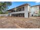 Expansive backyard featuring a white home with many windows and brick pavers at 409 San Sebastian Prado, Altamonte Springs, FL 32714