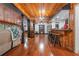 Spacious finished basement with wood paneling, hardwood floors, and a built-in bar at 409 San Sebastian Prado, Altamonte Springs, FL 32714