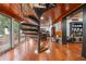 Finished basement with spiral staircase, office area, wood paneling, and hardwood floors at 409 San Sebastian Prado, Altamonte Springs, FL 32714