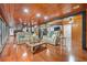 Finished basement with hardwood floors, seating area, and spiral staircase at 409 San Sebastian Prado, Altamonte Springs, FL 32714