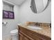 Bathroom featuring granite countertop, decorative mirror, and vanity at 409 San Sebastian Prado, Altamonte Springs, FL 32714