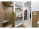Modern bathroom with tiled shower and shelving at 409 San Sebastian Prado, Altamonte Springs, FL 32714