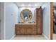 Bathroom vanity features double sinks, decorative mirror, and storage cabinet at 409 San Sebastian Prado, Altamonte Springs, FL 32714