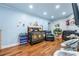 Comfortable baby room with hardwood floors and a cozy chair at 409 San Sebastian Prado, Altamonte Springs, FL 32714