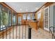 Bonus room with wood paneling, tile floors, and custom wet bar at 409 San Sebastian Prado, Altamonte Springs, FL 32714