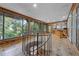 View of the bonus room with wood paneling, spiral staircase, and large picture window at 409 San Sebastian Prado, Altamonte Springs, FL 32714