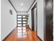 Inviting foyer with gleaming hardwood floors and modern front door at 409 San Sebastian Prado, Altamonte Springs, FL 32714