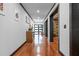 Hallway with hardwood floors and recessed lighting leads to living areas at 409 San Sebastian Prado, Altamonte Springs, FL 32714