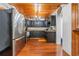 Kitchen featuring black cabinets, granite countertops, and stainless steel appliances at 409 San Sebastian Prado, Altamonte Springs, FL 32714