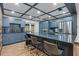 Modern kitchen with blue cabinets, granite countertops, stainless steel appliances and breakfast bar with seating at 409 San Sebastian Prado, Altamonte Springs, FL 32714