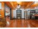 Kitchen featuring stainless steel appliances, dark cabinetry, coffee bar, and beamed ceilings at 409 San Sebastian Prado, Altamonte Springs, FL 32714