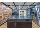 Spacious kitchen featuring blue cabinets, a large center island, and modern appliances including a stainless steel refrigerator at 409 San Sebastian Prado, Altamonte Springs, FL 32714