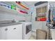 Laundry room with modern washer, dryer, shelving, and natural lighting at 409 San Sebastian Prado, Altamonte Springs, FL 32714
