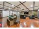 Open-concept living area with hardwood floors, comfortable seating, and stylish farmhouse decor at 409 San Sebastian Prado, Altamonte Springs, FL 32714