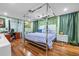 Spacious main bedroom with hardwood floors, canopy bed and decor at 409 San Sebastian Prado, Altamonte Springs, FL 32714