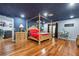 Main bedroom with hardwood floors, canopy bed, and ensuite at 409 San Sebastian Prado, Altamonte Springs, FL 32714