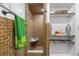 Tiled shower with marble bench and corner shelf next to custom open shelving at 409 San Sebastian Prado, Altamonte Springs, FL 32714