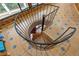 Wooden spiral staircase with iron railing and tiled floor at 409 San Sebastian Prado, Altamonte Springs, FL 32714