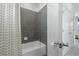 Bathroom with shower/tub combo, shower curtain, and grey tiled shower at 426 Belmond Dr, Debary, FL 32713