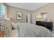 Stylish bedroom with a decorative mirror, modern furniture, and comfortable bedding at 426 Belmond Dr, Debary, FL 32713