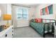 Cozy bedroom featuring natural light, carpet, patterned bedding, and modern decor at 426 Belmond Dr, Debary, FL 32713