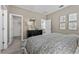 Bedroom showcasing neutral walls, modern decor, and a stylish bed with geometric patterned linens at 426 Belmond Dr, Debary, FL 32713