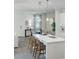 Bright kitchen with white cabinets, stainless steel appliances, and a large island with bar seating at 426 Belmond Dr, Debary, FL 32713