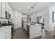 Modern kitchen with a center island, stainless steel appliances, and sliding glass doors to the patio at 426 Belmond Dr, Debary, FL 32713
