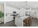 Bright kitchen featuring stainless steel appliances, a large island with seating, and sleek countertops at 426 Belmond Dr, Debary, FL 32713