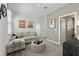 Cozy upstairs living room with comfortable seating, neutral colors and movie-themed decor at 426 Belmond Dr, Debary, FL 32713