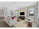 Bright living room with comfortable seating, modern decor, and large windows at 426 Belmond Dr, Debary, FL 32713