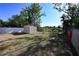 Fenced backyard with a storage shed, offering space and privacy at 443 S Observatory Dr, Orlando, FL 32835