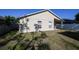 Spacious backyard featuring the home's exterior and a serene outdoor space at 443 S Observatory Dr, Orlando, FL 32835