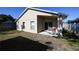 Exterior view of the back of the home with a patio, ideal for entertaining at 443 S Observatory Dr, Orlando, FL 32835