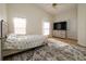 Comfortable bedroom with tiled flooring, ceiling fan, natural light and neutral wall color at 443 S Observatory Dr, Orlando, FL 32835