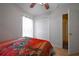 Bedroom featuring a double door closet and bright natural light at 443 S Observatory Dr, Orlando, FL 32835