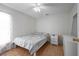 Comfortable bedroom with tiled flooring, ceiling fan, natural light and neutral wall color at 443 S Observatory Dr, Orlando, FL 32835