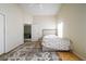 Bright bedroom with tiled flooring, ceiling fan, natural light, and doorway into another room at 443 S Observatory Dr, Orlando, FL 32835